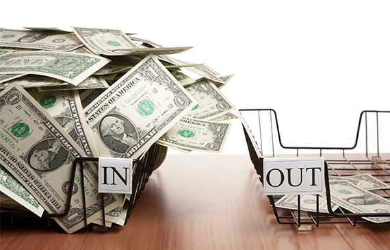 Two office trays labeled ‘In’ and ‘Out,’ with the ‘In’ tray overflowing with cash and the ‘Out’ tray nearly empty, symbolizing strong cash flow. Represents how financing equipment with Beacon Funding helps businesses preserve working capital, maintain steady cash flow, and avoid large upfront costs. Two office trays labeled ‘In’ and ‘Out,’ with the ‘In’ tray overflowing with cash and the ‘Out’ tray nearly empty, symbolizing strong cash flow. Represents how financing equipment with Beacon Funding helps businesses preserve working capital, maintain steady cash flow, and avoid large upfront costs.